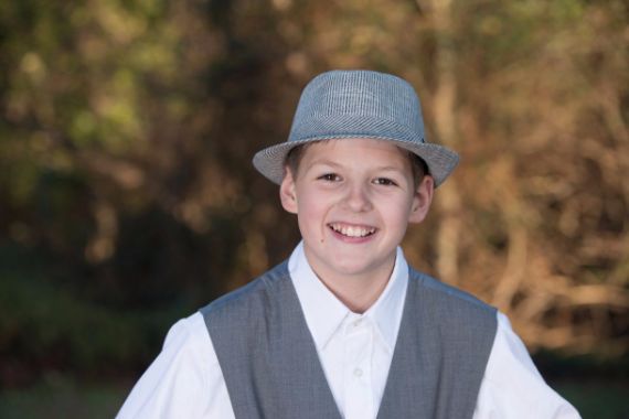 photograph of child in hat